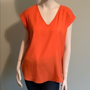 New York & Company orange people.